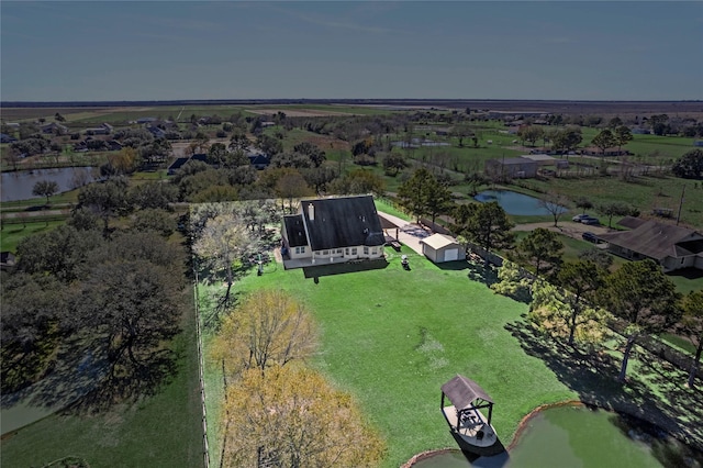 drone / aerial view featuring a water view and a rural view