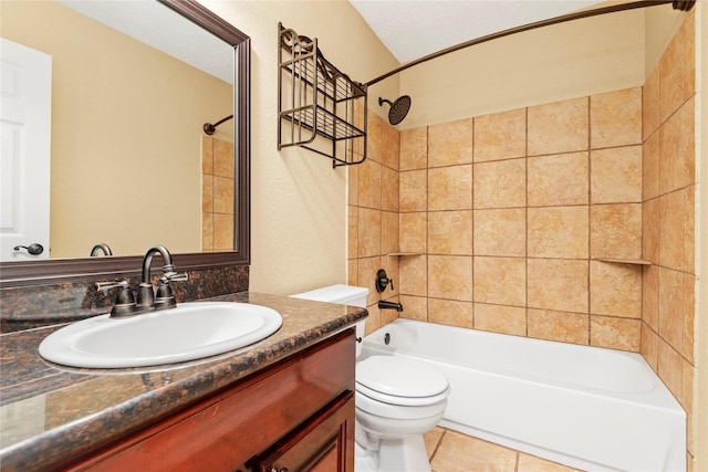 full bathroom featuring vanity, toilet, and tiled shower / bath