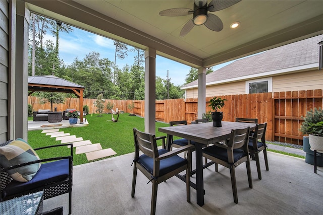 view of patio / terrace featuring a gazebo, ceiling fan, and an outdoor living space