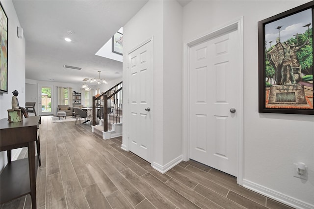 foyer featuring a notable chandelier