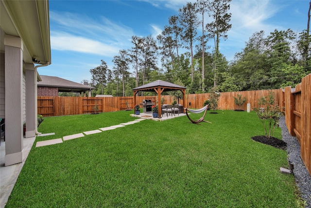 view of yard featuring a gazebo and a patio area