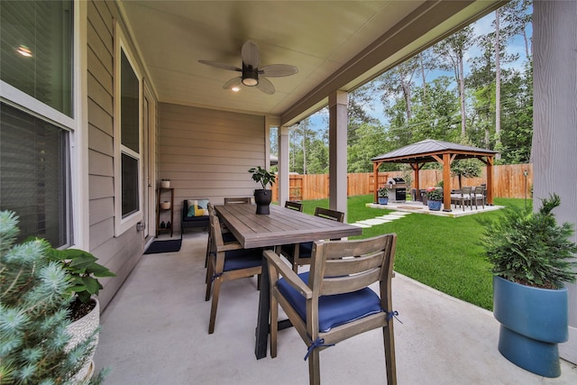 view of patio with a gazebo, ceiling fan, and area for grilling