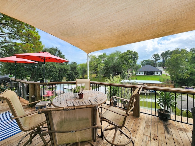 wooden deck featuring a water view