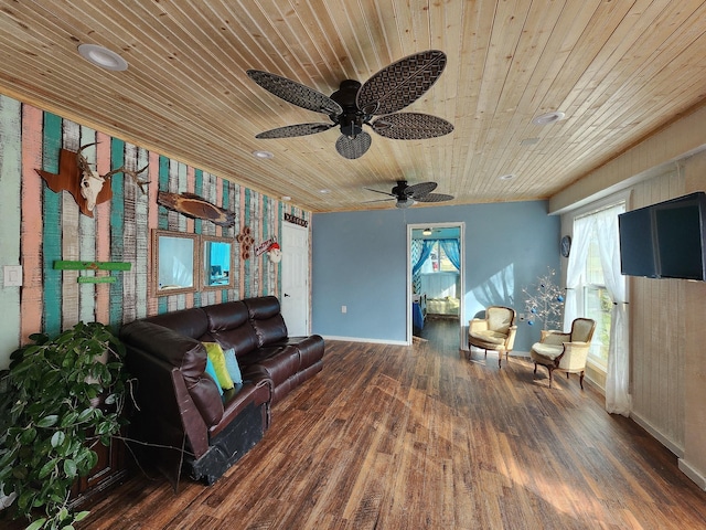 living room with ceiling fan, dark hardwood / wood-style flooring, and wood ceiling