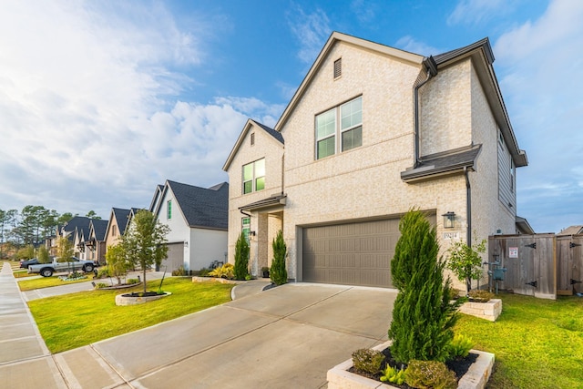 view of front of house featuring a front yard and a garage