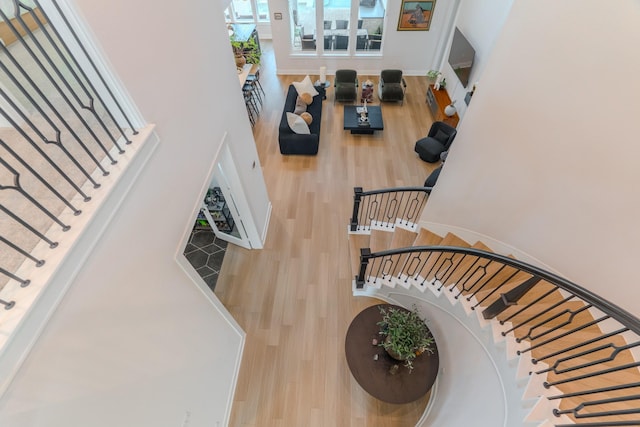 staircase featuring wood-type flooring