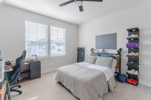 bedroom featuring light colored carpet and ceiling fan