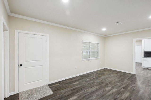 unfurnished room featuring crown molding and dark hardwood / wood-style flooring