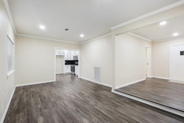 unfurnished living room featuring dark hardwood / wood-style floors and ornamental molding