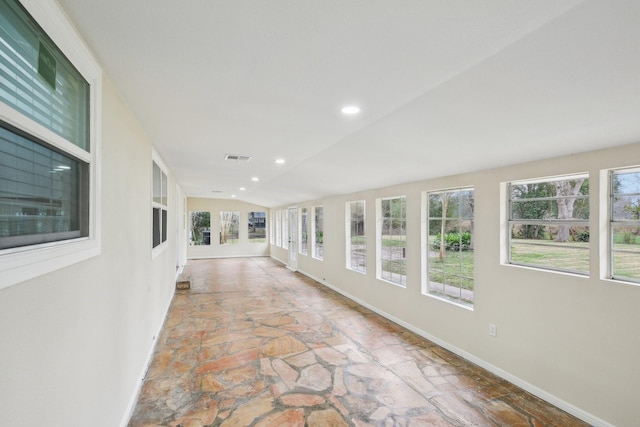 unfurnished sunroom with lofted ceiling