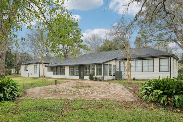 back of property featuring a patio area, a yard, and central air condition unit