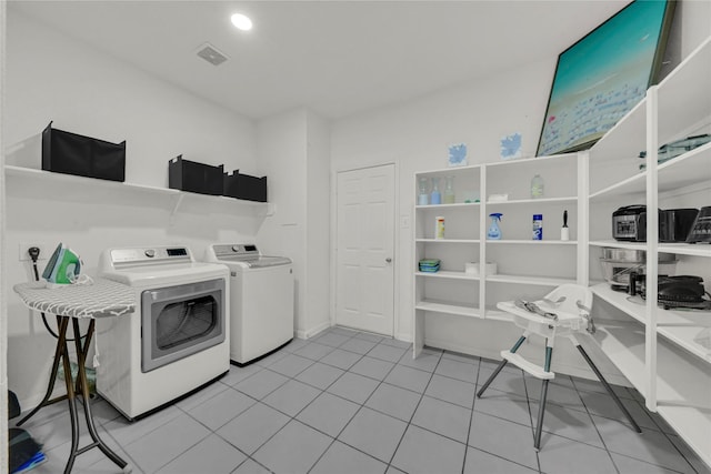 washroom featuring light tile patterned floors and separate washer and dryer