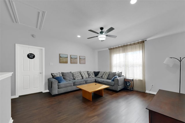 living room with ceiling fan and dark hardwood / wood-style flooring