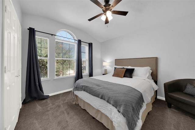 bedroom featuring a closet, dark carpet, ceiling fan, and lofted ceiling