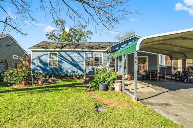 exterior space with a front lawn and a carport