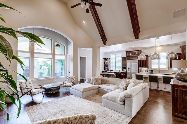 living room featuring beam ceiling, ceiling fan, high vaulted ceiling, and dark hardwood / wood-style floors