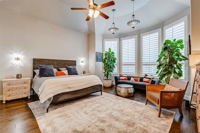 bedroom featuring vaulted ceiling, ceiling fan, and dark wood-type flooring