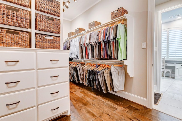 walk in closet featuring hardwood / wood-style floors