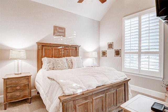 bedroom featuring multiple windows, ceiling fan, light colored carpet, and lofted ceiling