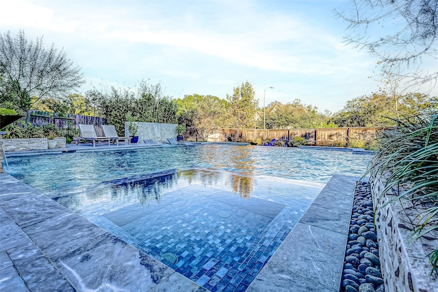 view of pool with pool water feature