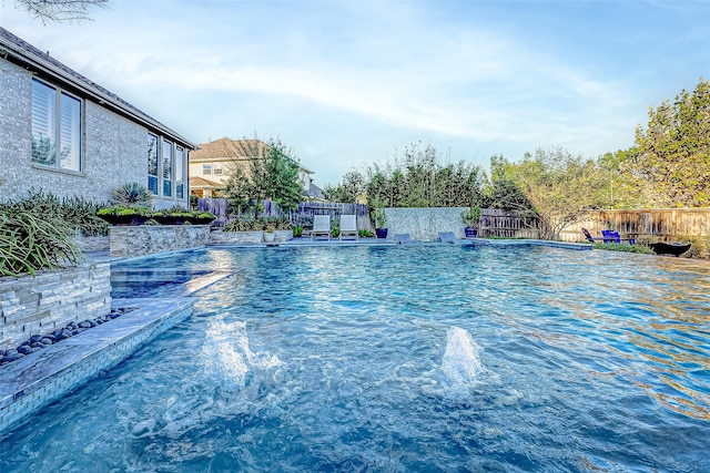 view of swimming pool featuring pool water feature