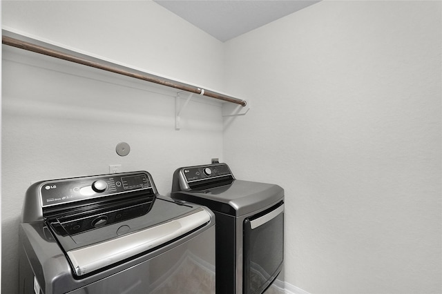 laundry area with separate washer and dryer