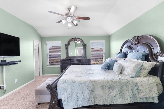 carpeted bedroom with ceiling fan and lofted ceiling