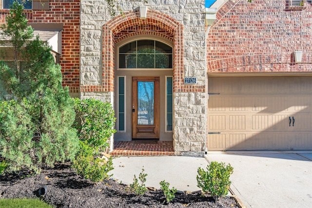 doorway to property featuring a garage