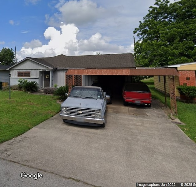 single story home featuring a front yard and a carport