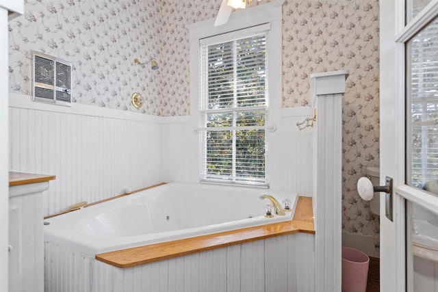 bathroom with a tub to relax in