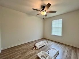 unfurnished room with hardwood / wood-style floors