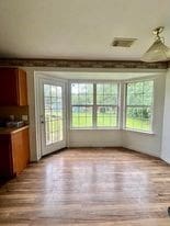 interior space featuring a wealth of natural light and light hardwood / wood-style floors