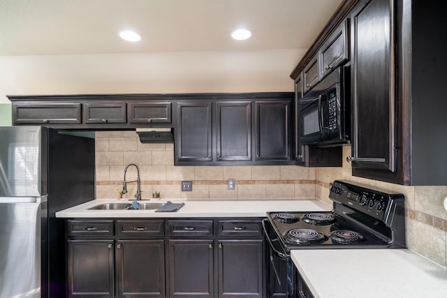 kitchen featuring tasteful backsplash, sink, black appliances, and dark brown cabinets