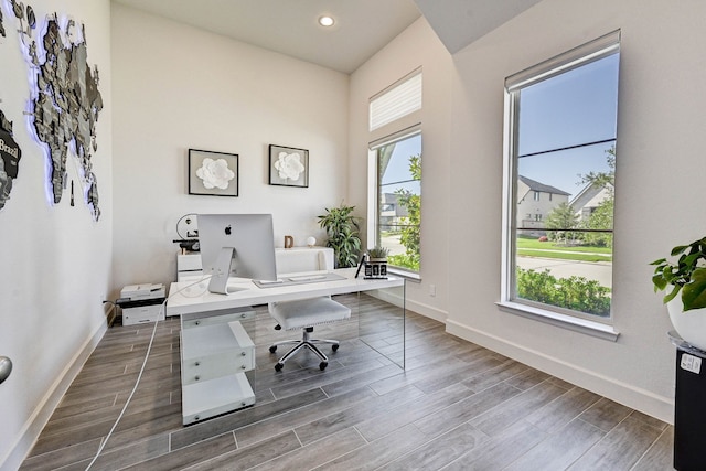 office space with wood tiled floor, baseboards, and recessed lighting