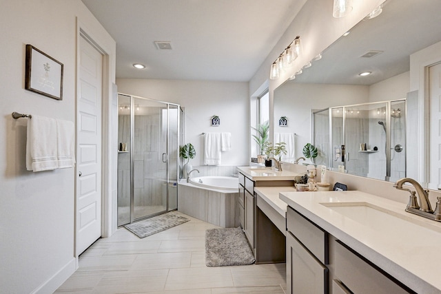 bathroom featuring visible vents, a shower stall, vanity, and a bath