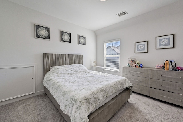 bedroom with light carpet and visible vents