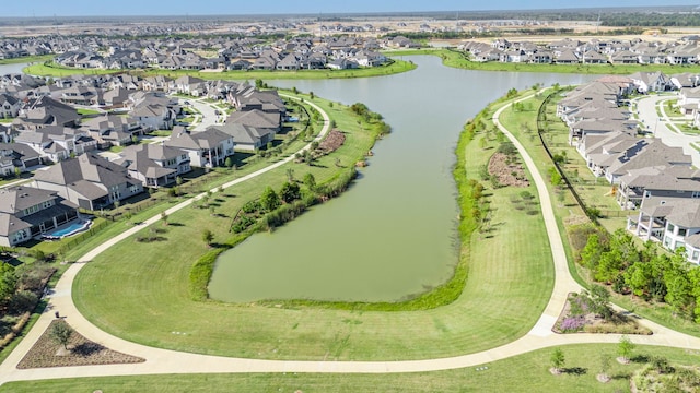 birds eye view of property featuring a residential view and a water view