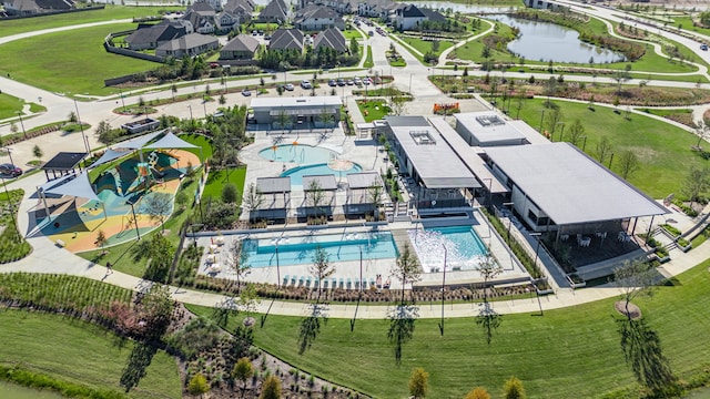 aerial view with a water view and a residential view