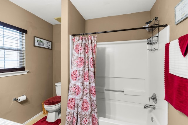 bathroom with toilet and shower / bathtub combination with curtain