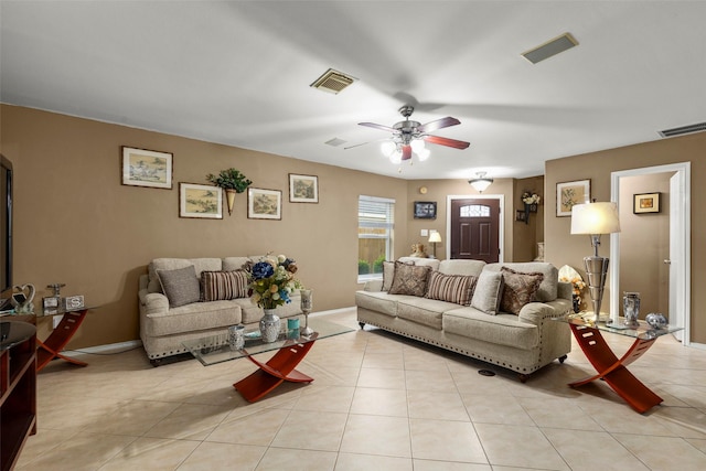 tiled living room with ceiling fan