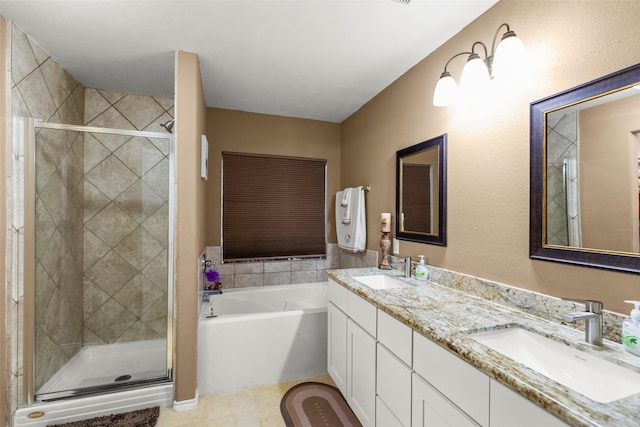 bathroom with tile patterned flooring, plus walk in shower, and vanity