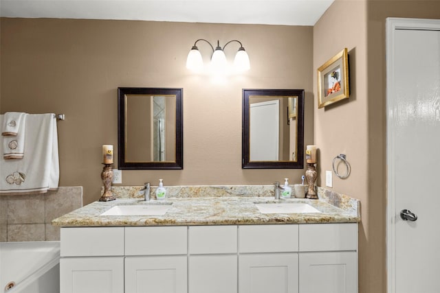 bathroom with a bath and vanity