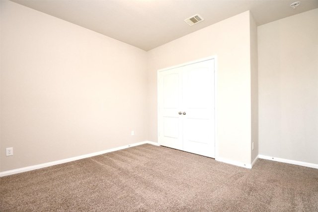 unfurnished bedroom with carpet floors