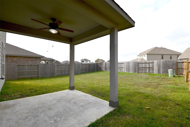 view of yard featuring a patio and ceiling fan