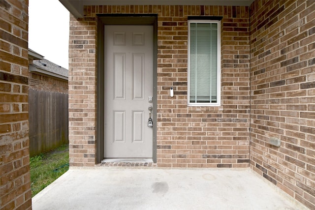 entrance to property featuring a patio area