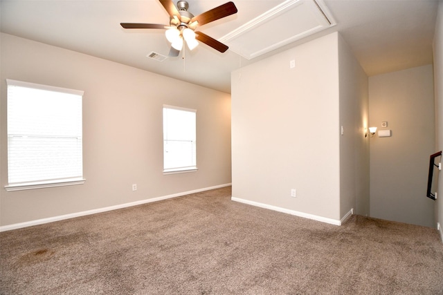 spare room featuring ceiling fan and carpet floors