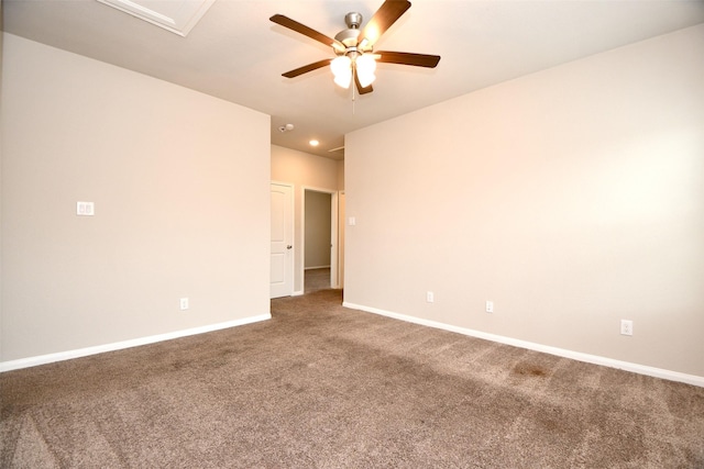 carpeted empty room featuring ceiling fan