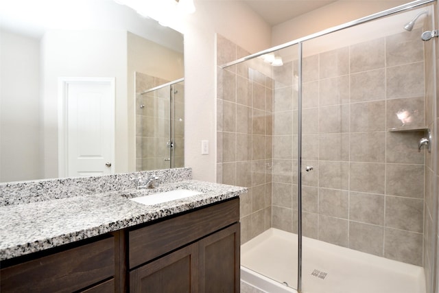 bathroom featuring vanity and walk in shower