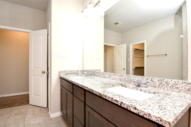 bathroom featuring tile patterned floors and vanity