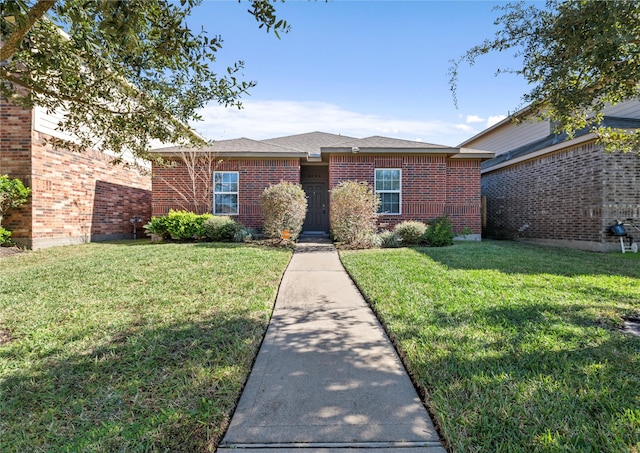 ranch-style home with a front lawn